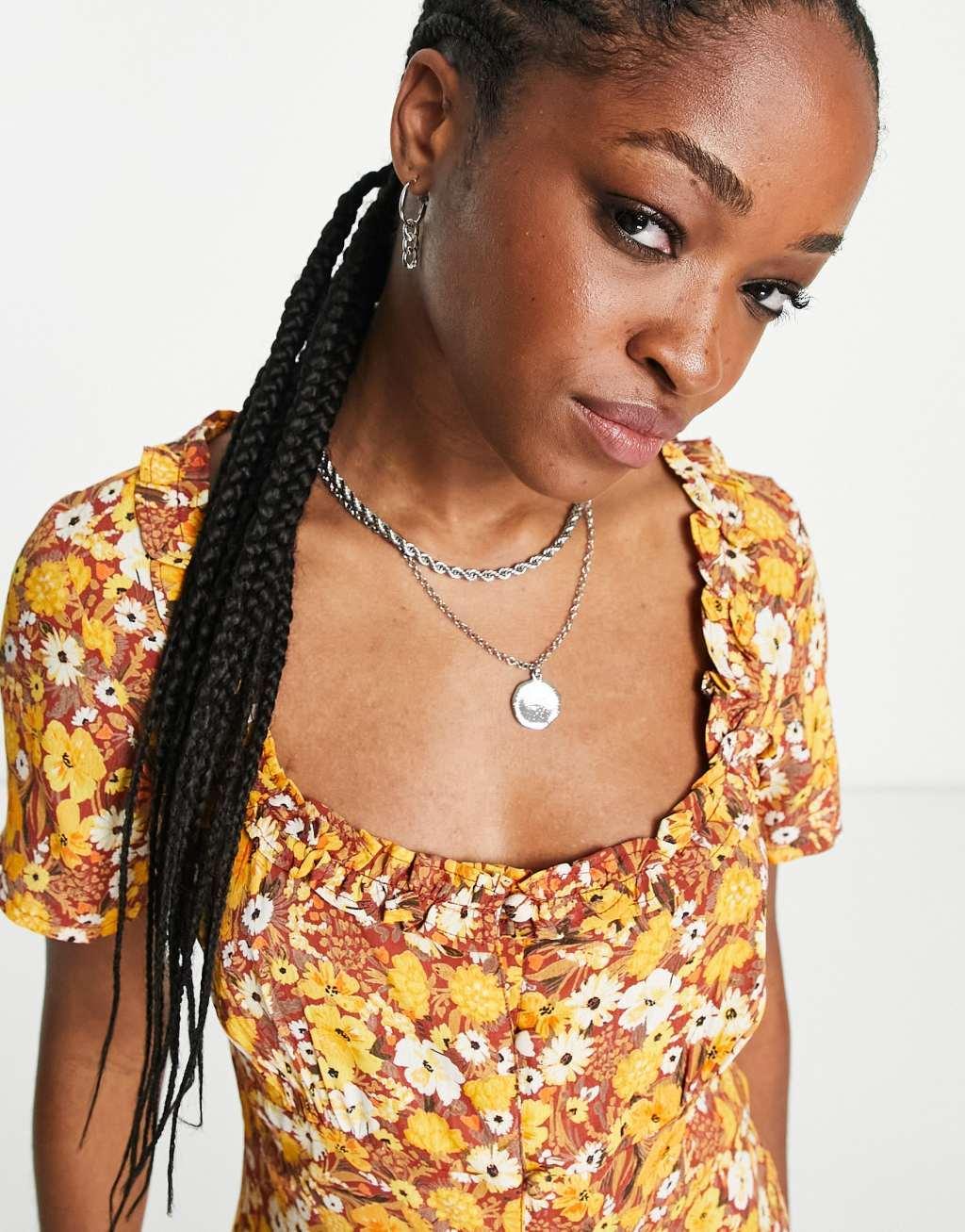 Reclaimed Vintage short sleeve romper with ruffle trim in vintage brown floral Product Image