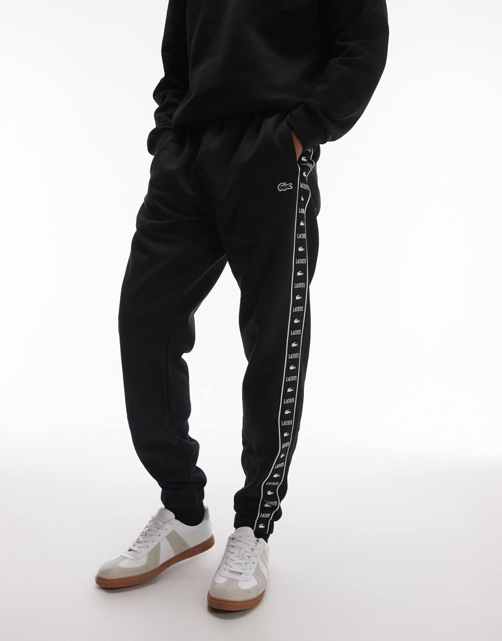 Lacoste logo stripe sweatpants in black  Product Image