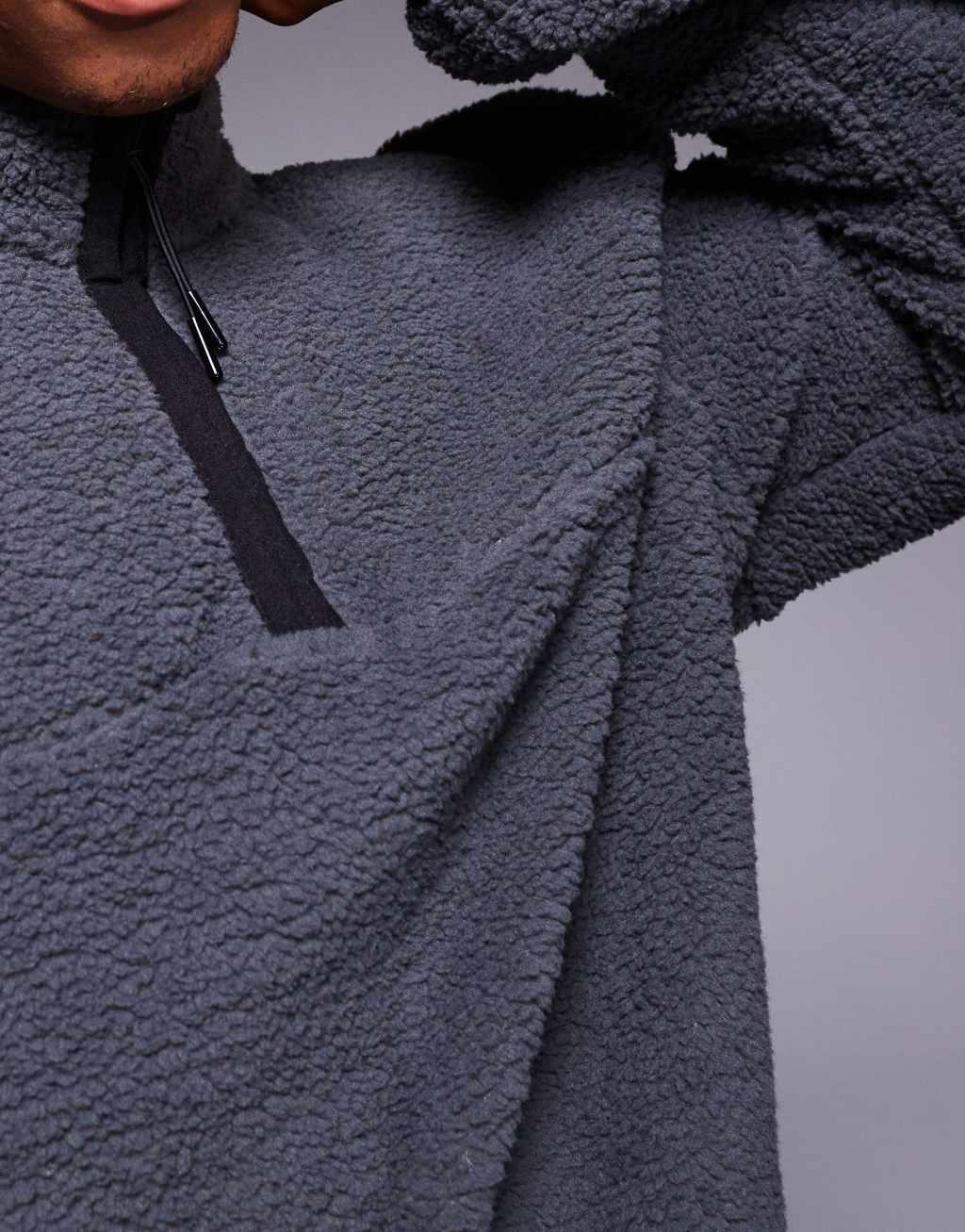 ASOS DESIGN boxy oversized quarter zip borg sweatshirt in washed black Product Image