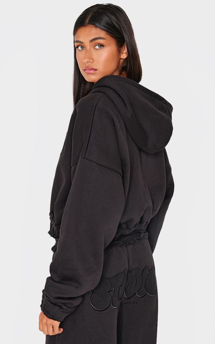 PRETTYLITTLETHING Black Studio Embroidered Raw Hem Detail Zip Up Hoodie Product Image