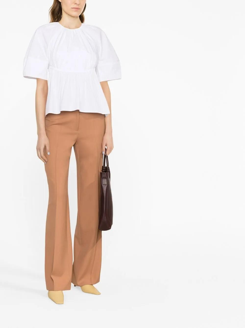 JIL SANDER Peplum Waist Cut-out Top In White Product Image