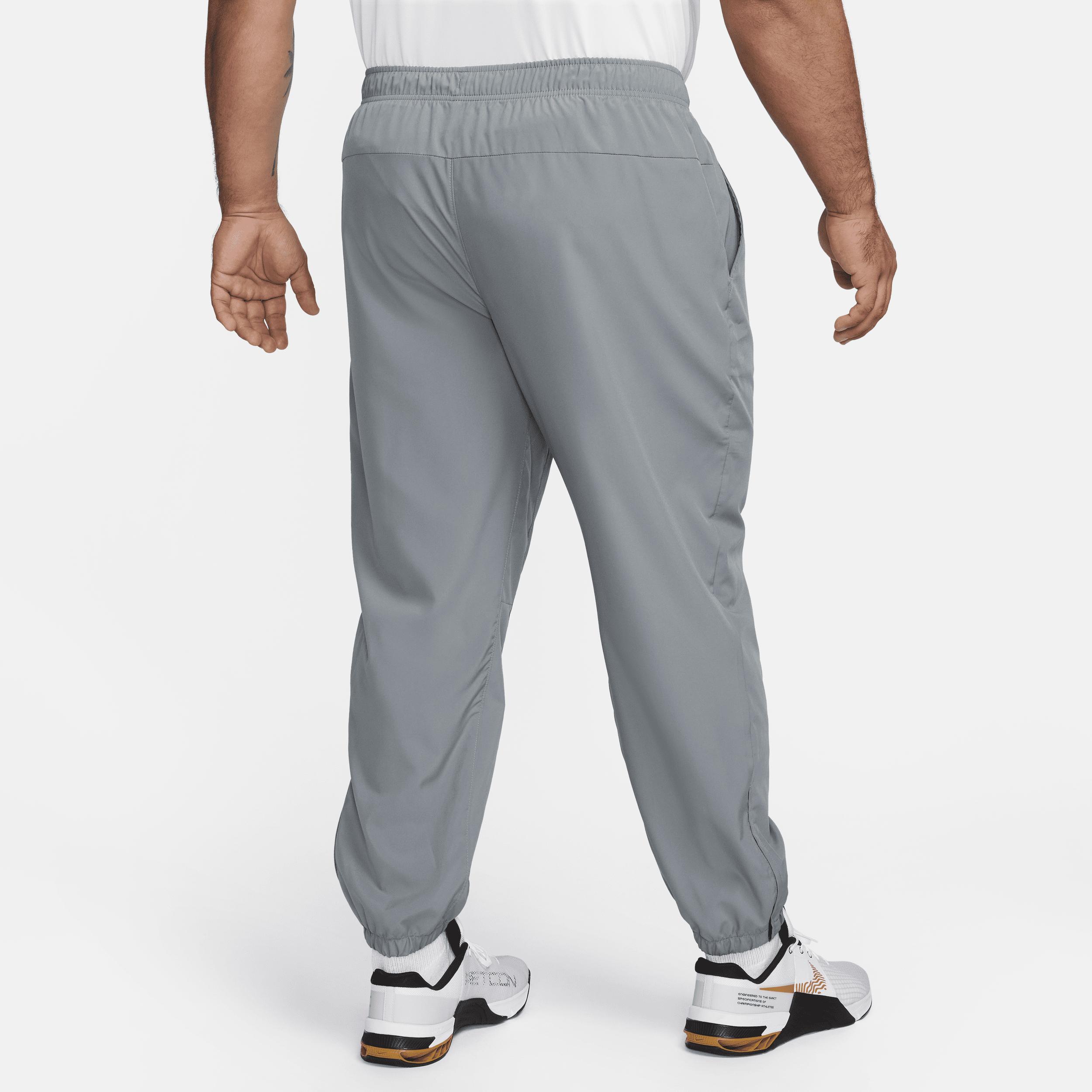 Nike Men's Form Dri-FIT Tapered Versatile Pants in Grey/Smoke Grey Size Large 100% Polyester Product Image