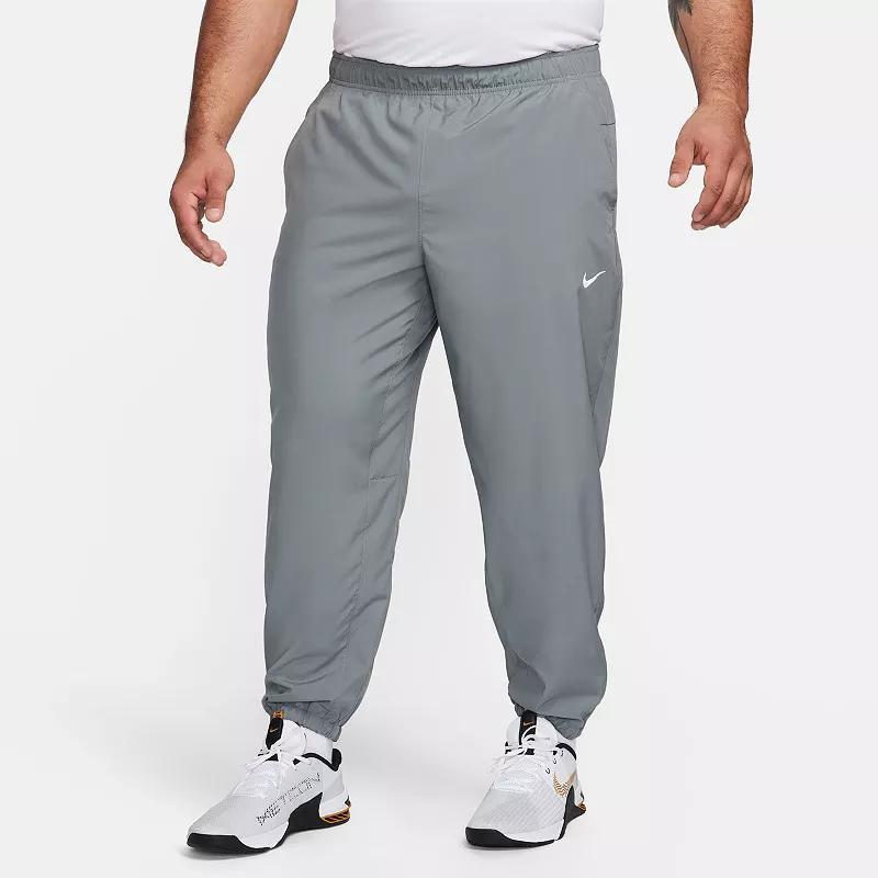 Nike Men's Form Dri-FIT Tapered Versatile Pants in Grey/Smoke Grey Size Large 100% Polyester Product Image