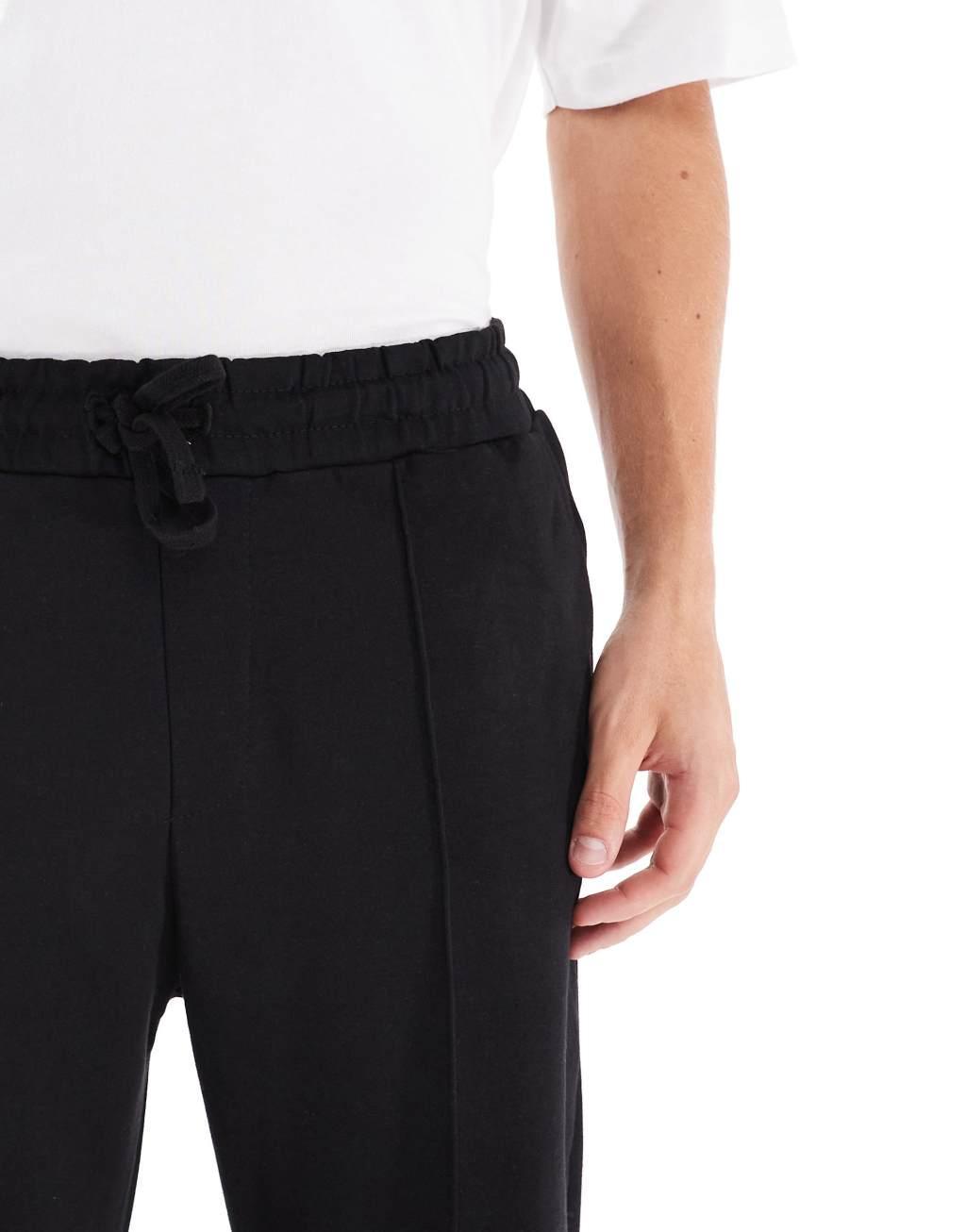 Bershka wide leg pintuck sweatpants in black Product Image