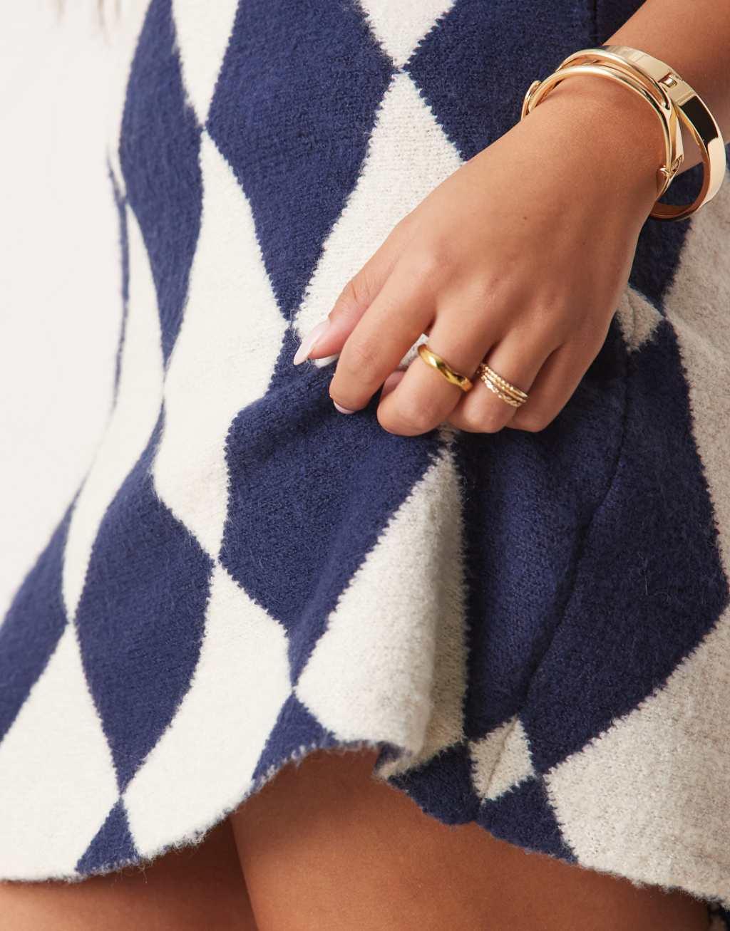 Neon Rose argyle knit mini skirt in navy Product Image