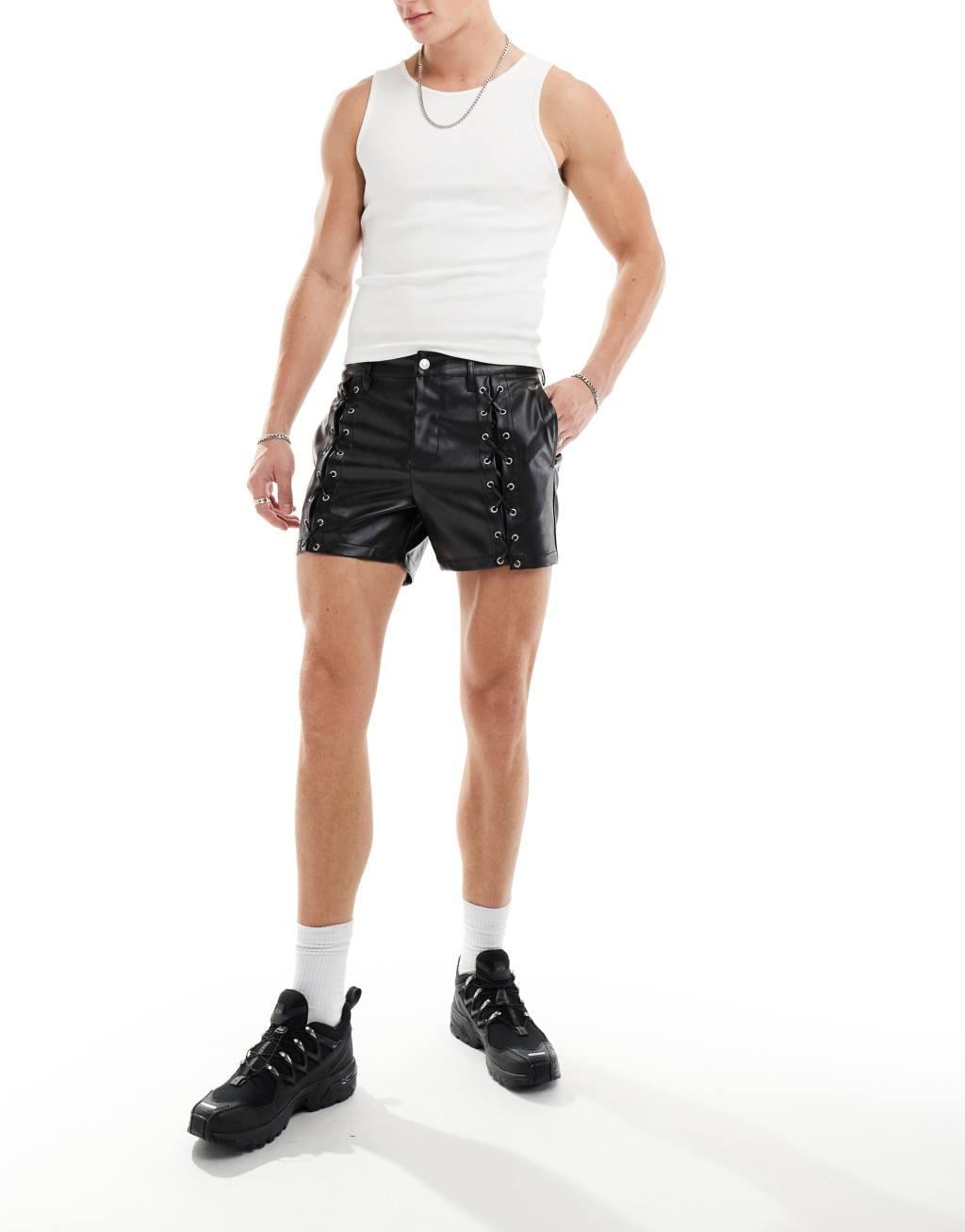 ASOS DESIGN slim leather look shorts with lace up details in black Product Image