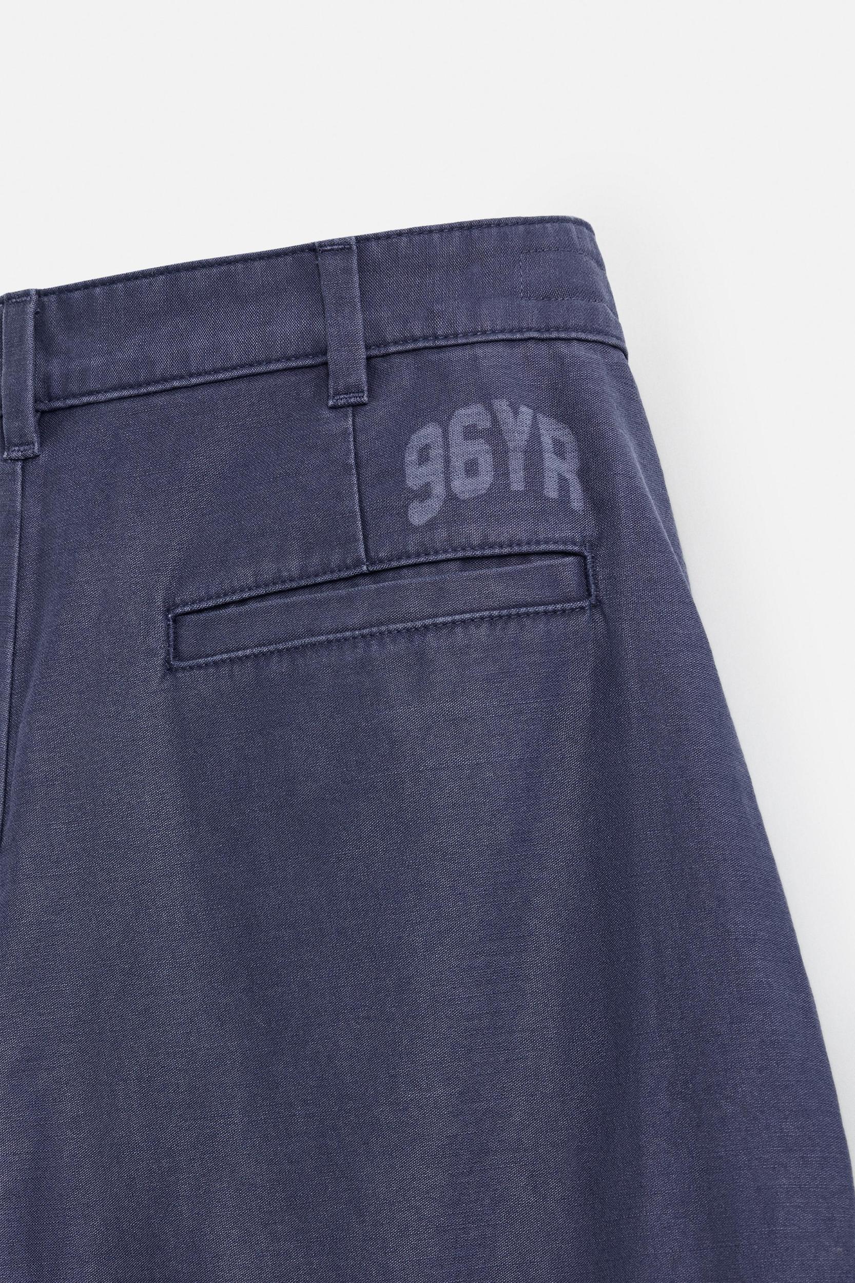 RELAXED FIT PLEATED JEANS Product Image