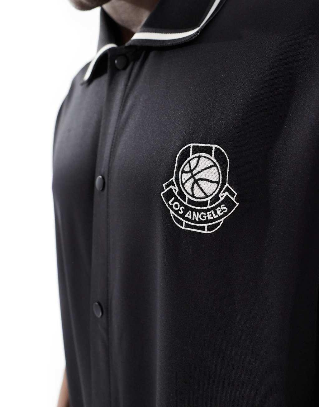 Bershka sports tipped collar shirt in black Product Image
