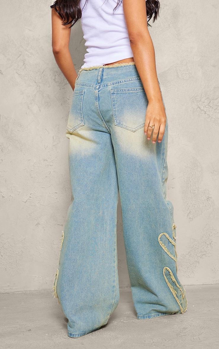 Petite Vintage Bleach Wash Mid Rise Embroidered Wide Leg Jeans Product Image
