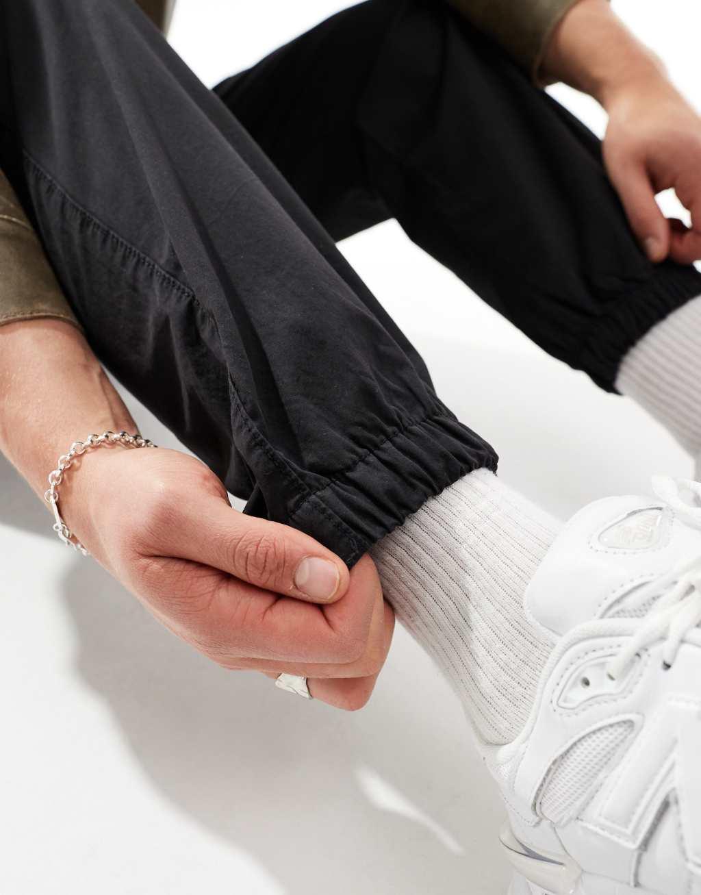 ASOS DESIGN tapered pull on pants in washed black Product Image