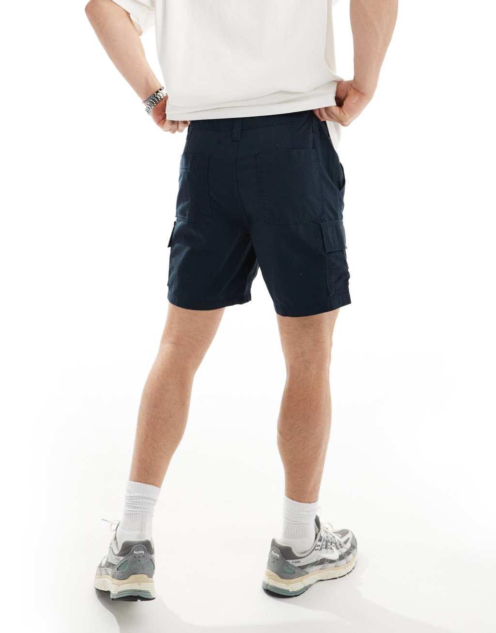 ASOS DESIGN slim cargo shorts in regular length with patch in navy Product Image
