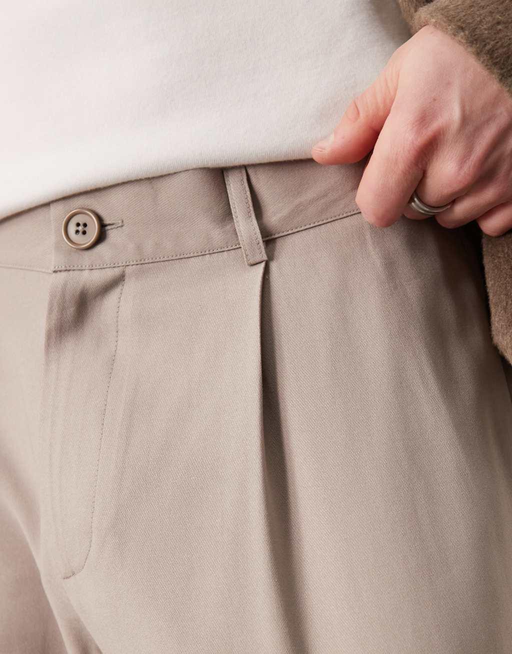 ASOS DESIGN wide flare dress pants with pleats in beige Product Image