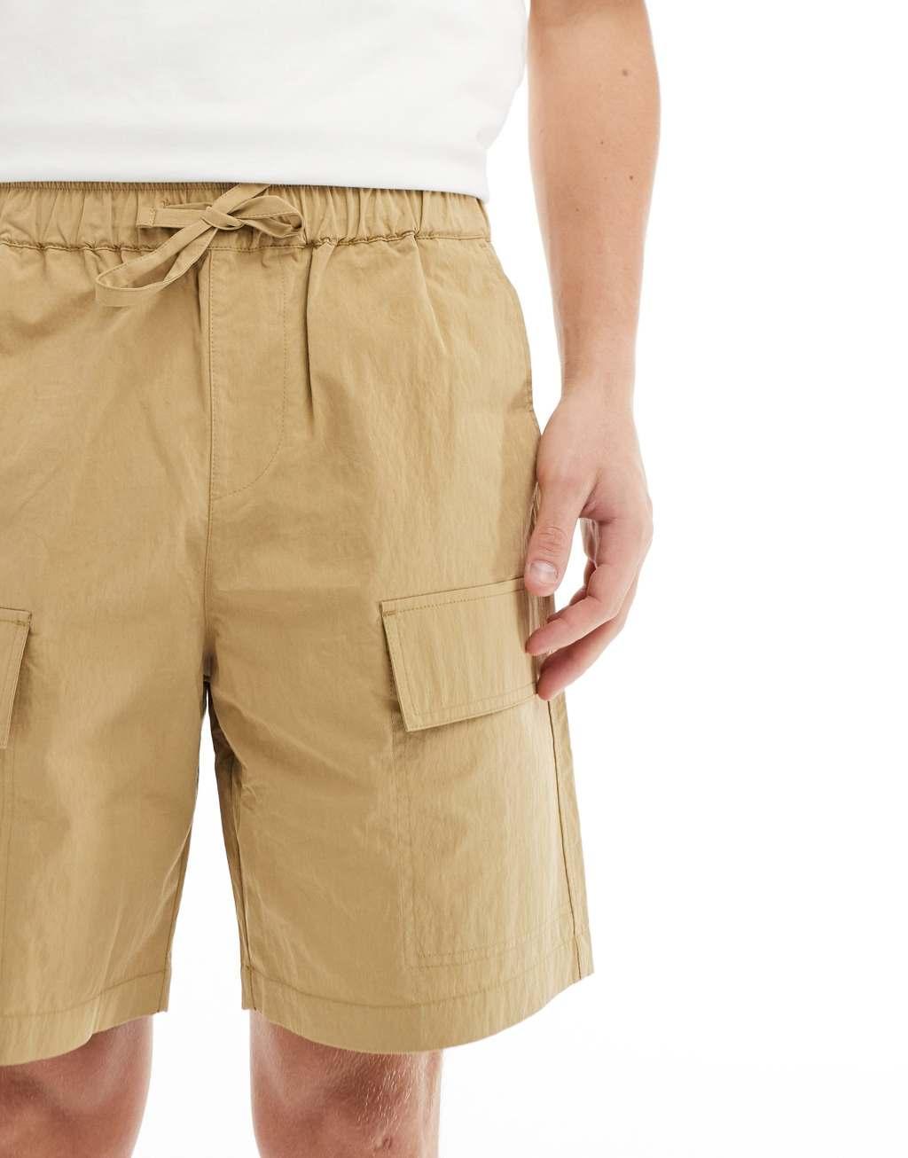 ASOS DESIGN cargo nylon shorts in beige Product Image