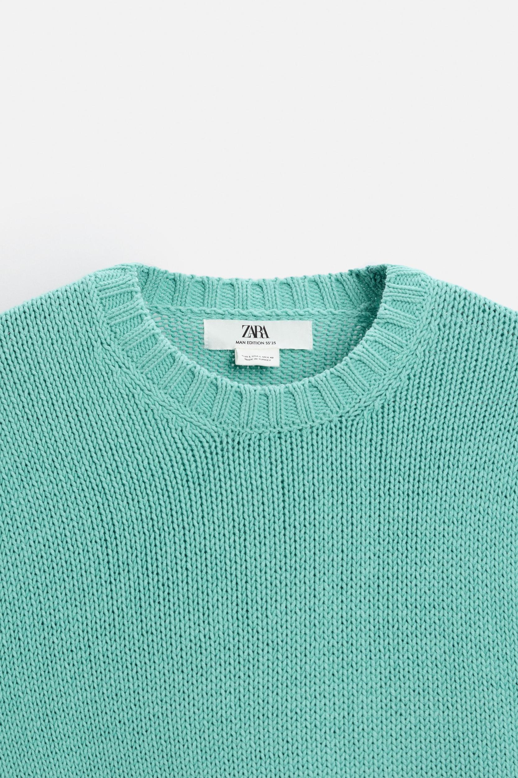 Relaxed fit cotton blend sweater. Round neck and long sleeves. Rib trim. Product Image